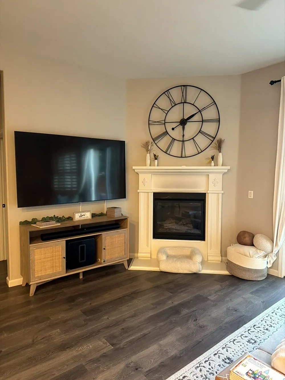 Before: painted wood mantel surround around a small firebox