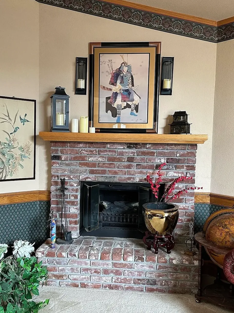 Before: old red brick corner fireplace with a wood mantel