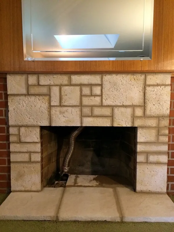 Cut stone fireplace by Nick Lambdin Masonry