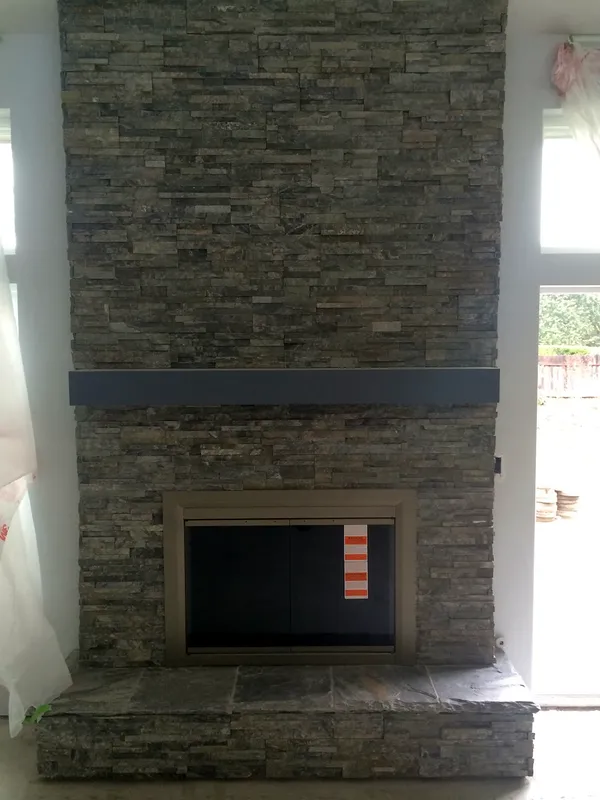 Stacked stone fireplace by Nick Lambdin Masonry