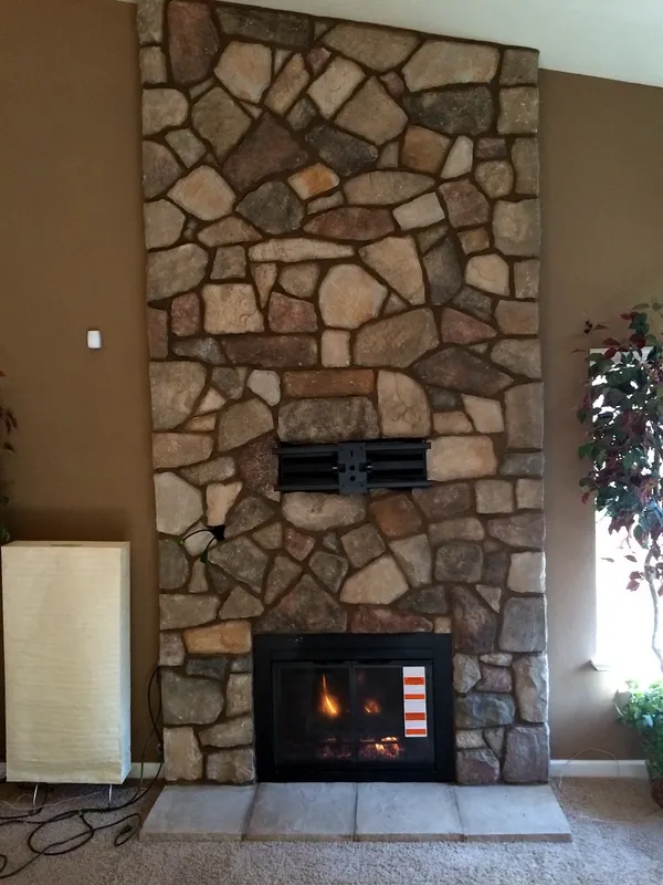 Fieldstone fireplace by Nick Lambdin Masonry