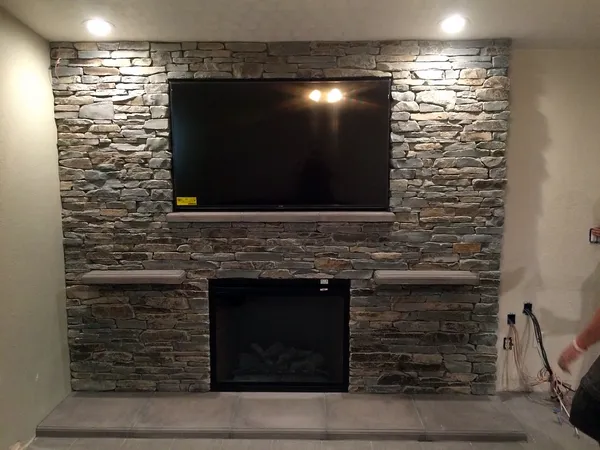 Stacked stone wall by Nick Lambdin Masonry