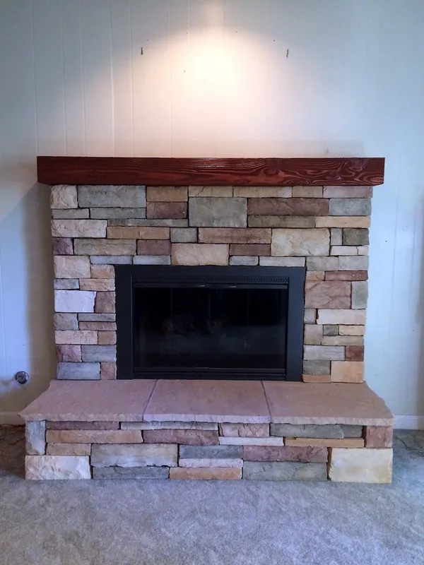 Stacked stone fireplace by Nick Lambdin Masonry