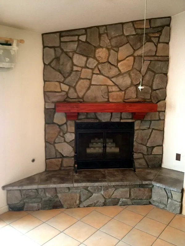 Fieldstone fireplace by Nick Lambdin Masonry