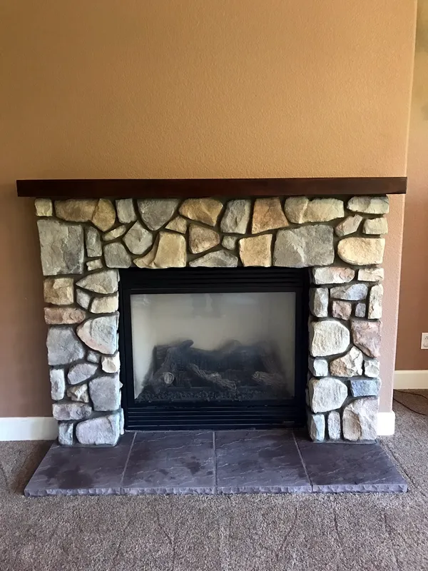 Fieldstone fireplace by Nick Lambdin Masonry