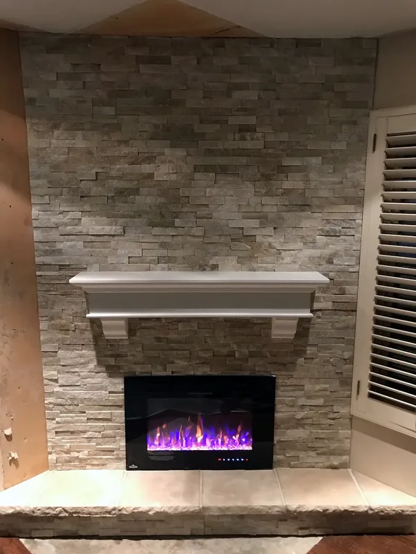 Ledgestone fireplace by Nick Lambdin Masonry