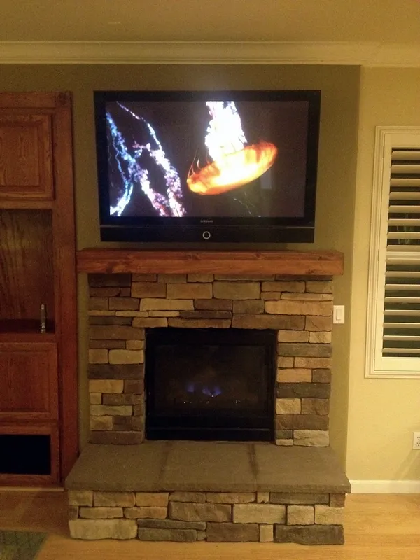 Stacked stone fireplace by Nick Lambdin Masonry