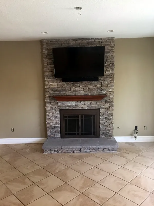 Ledgestone fireplace by Nick Lambdin Masonry