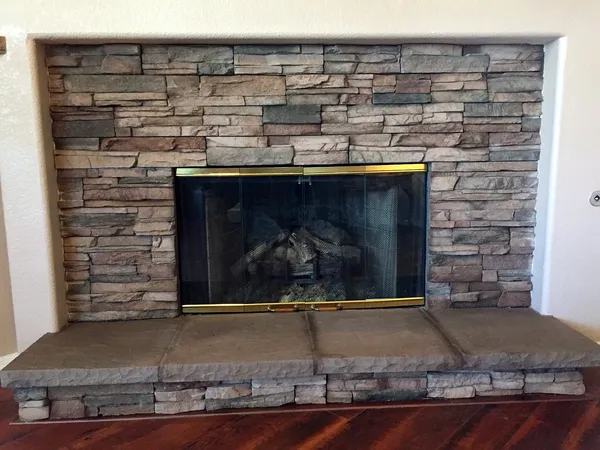 Ledgestone fireplace by Nick Lambdin Masonry
