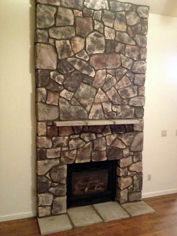 Fieldstone fireplace by Nick Lambdin Masonry