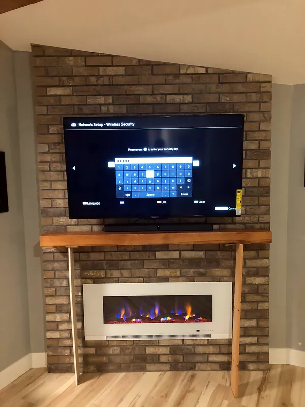 Brick fireplace by Nick Lambdin Masonry