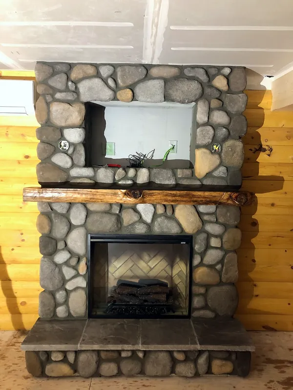 River rock fireplace by Nick Lambdin Masonry