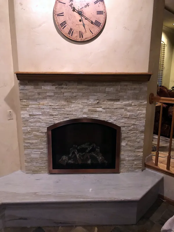 Stacked stone fireplace by Nick Lambdin Masonry