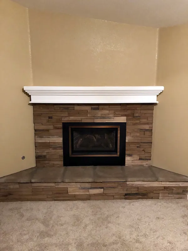 Stacked stone fireplace by Nick Lambdin Masonry