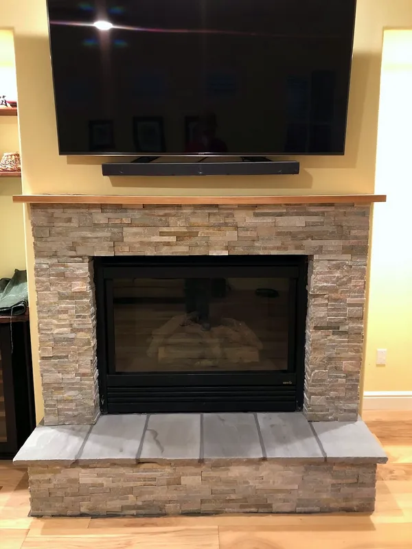 Stacked stone fireplace by Nick Lambdin Masonry