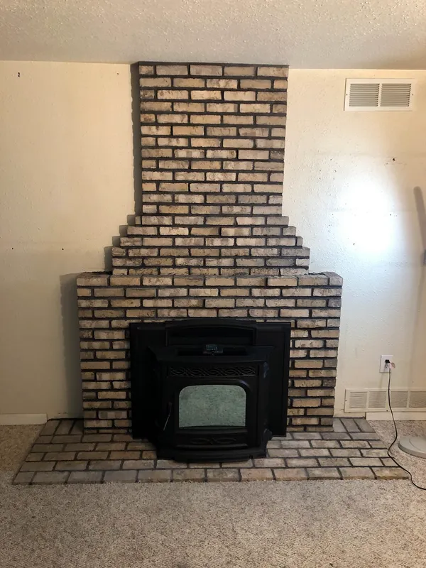 Brick fireplace by Nick Lambdin Masonry