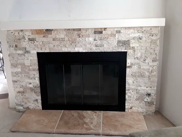 Stacked stone fireplace by Nick Lambdin Masonry