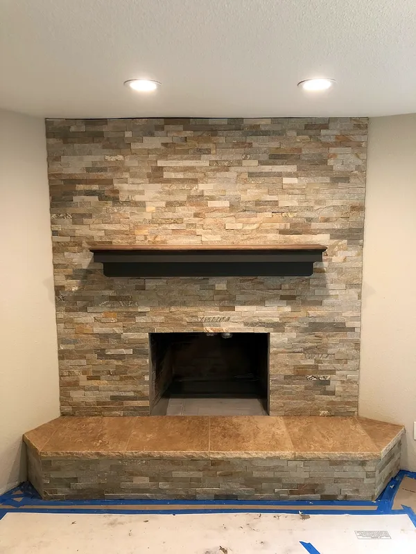 Stacked stone fireplace by Nick Lambdin Masonry