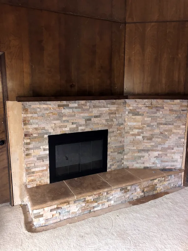 Ledgestone fireplace by Nick Lambdin Masonry