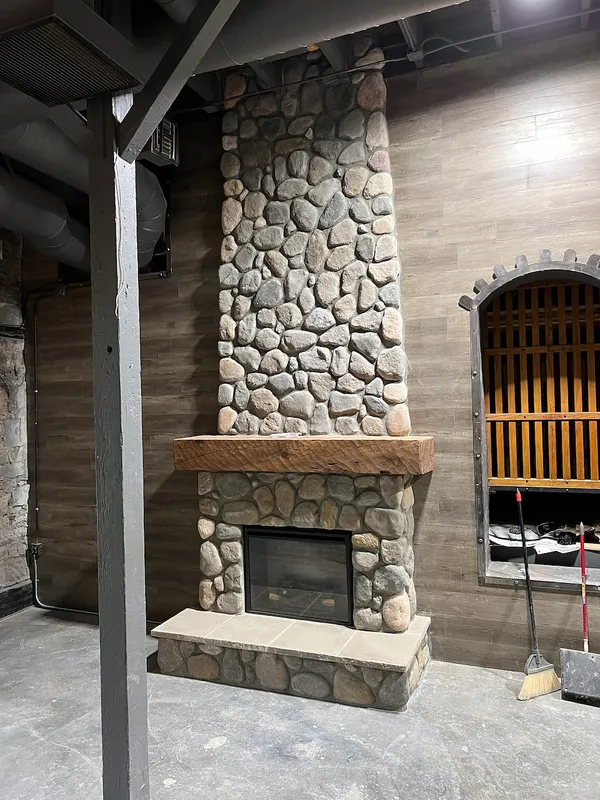 River rock fireplace by Nick Lambdin Masonry