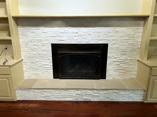Split-face stone fireplace by Nick Lambdin Masonry