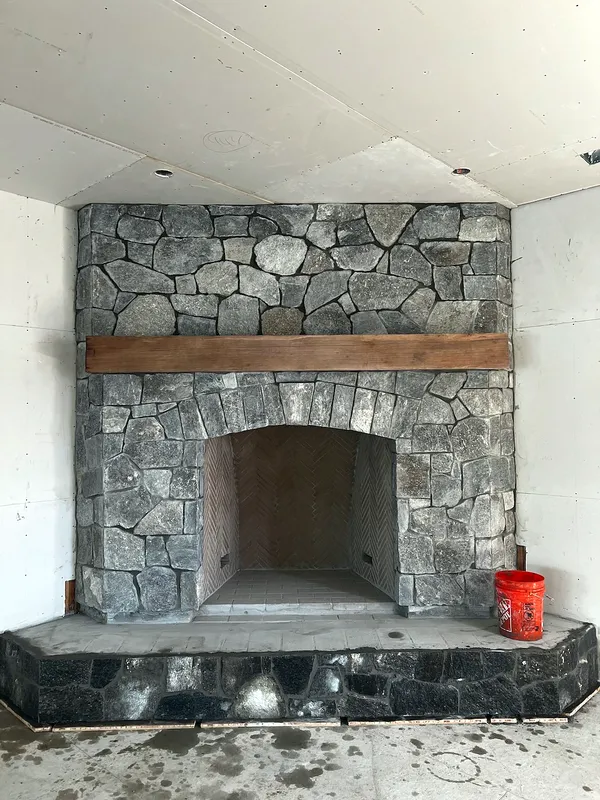 Fieldstone fireplace by Nick Lambdin Masonry