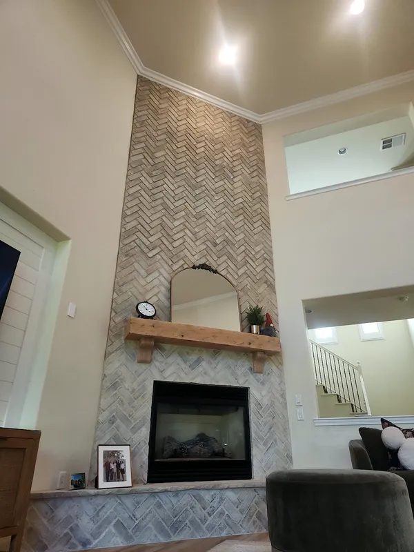 Herringbone brick fireplace by Nick Lambdin Masonry