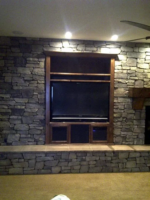 Stone veneer fireplace by Nick Lambdin Masonry