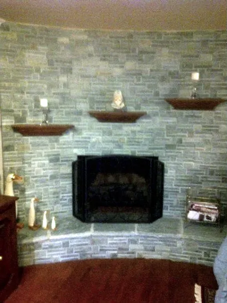 Stone veneer fireplace by Nick Lambdin Masonry