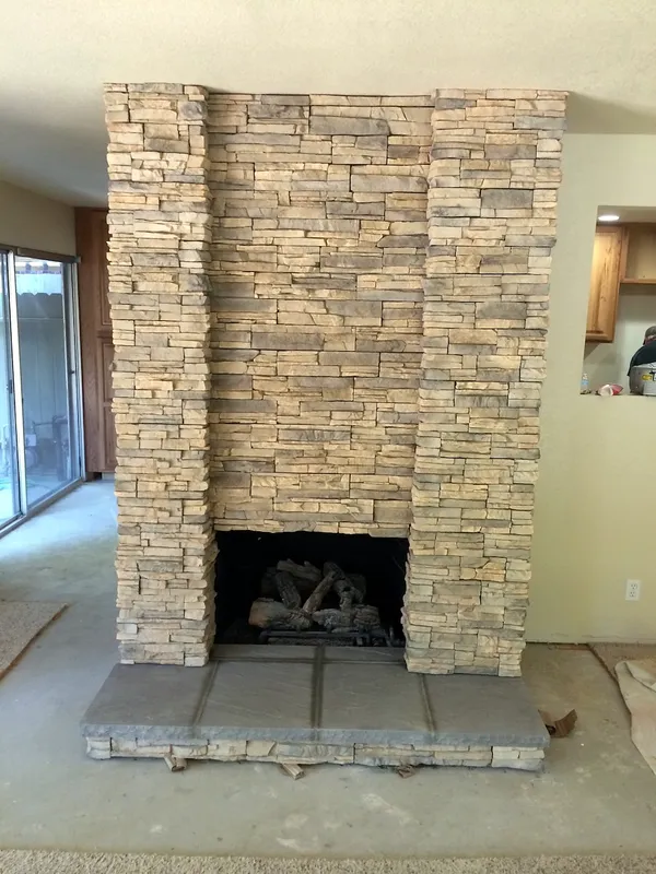 Ledgestone fireplace by Nick Lambdin Masonry