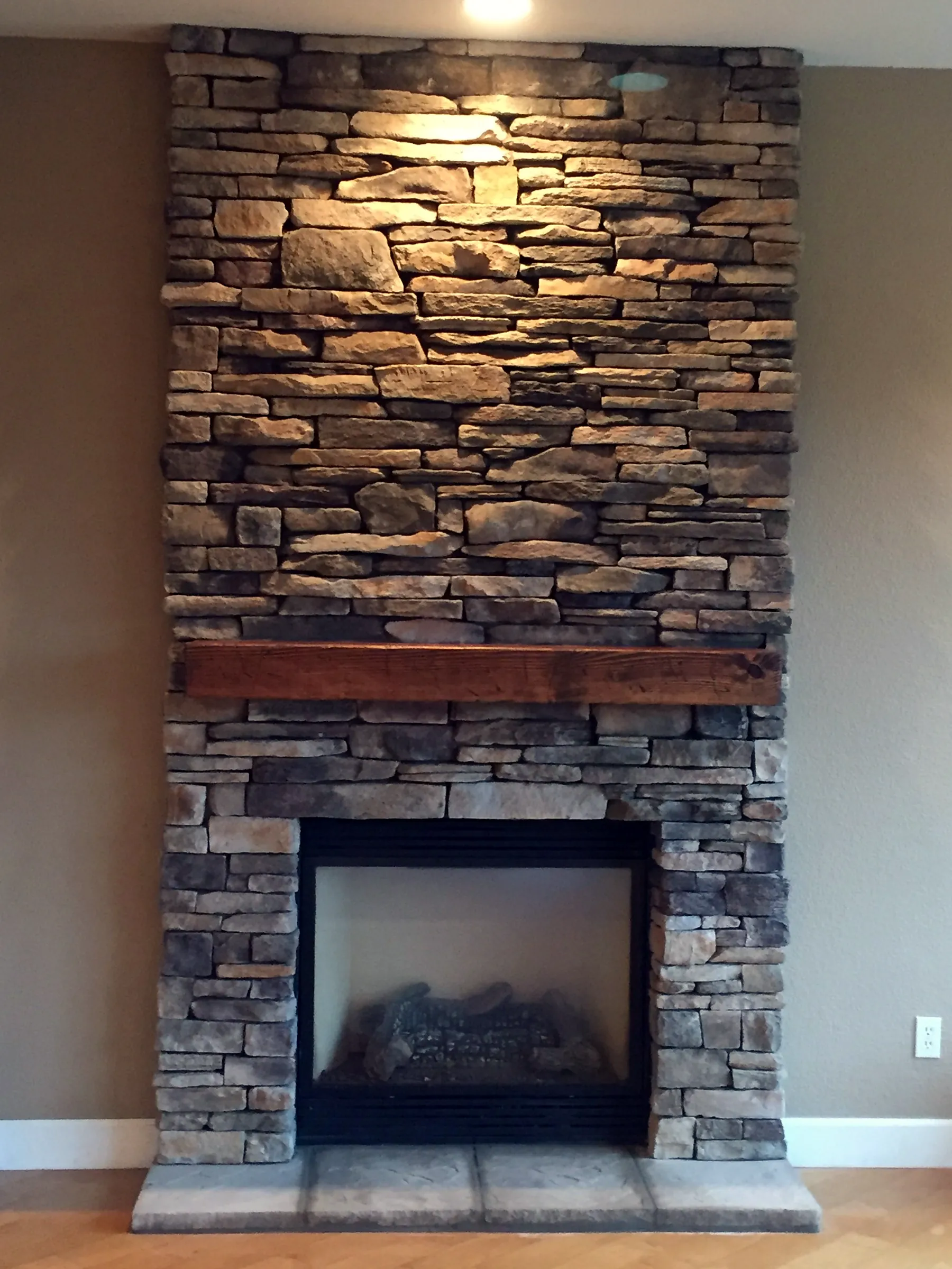 Stacked stone fireplace by Nick Lambdin Masonry